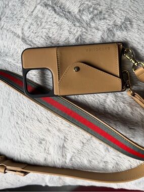 Bandolier Tan Leather Crossbody Phone Case with Striped Strap For iPhone 13 Pro.